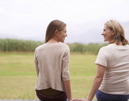 Mother and daughter sitting and together